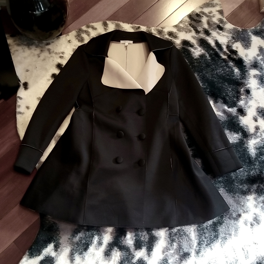 Black & cream colored double brested suit jacket.